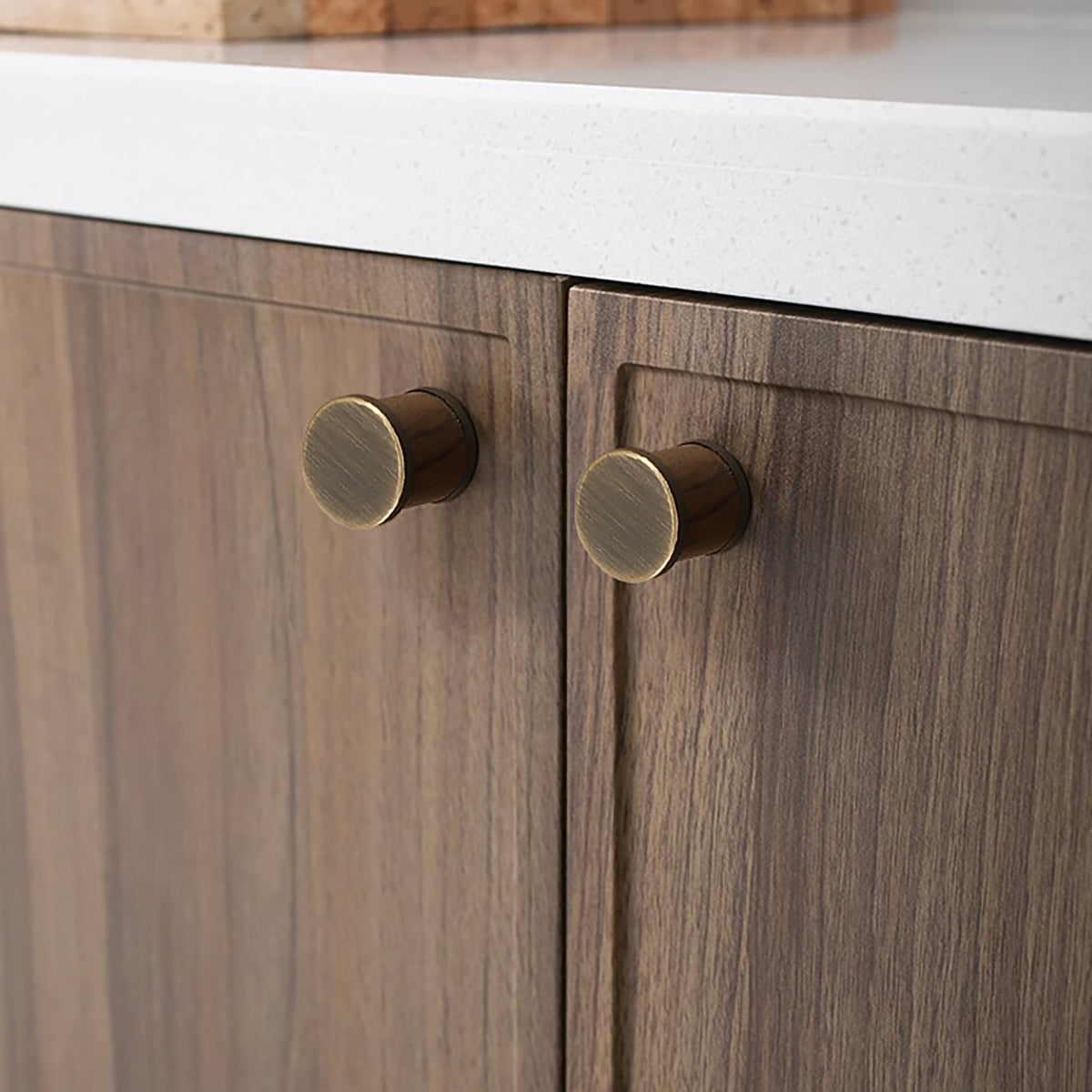In-use view of dark wood barrel cabinet knob with coffee-finish end caps, style #7 Coffee.
