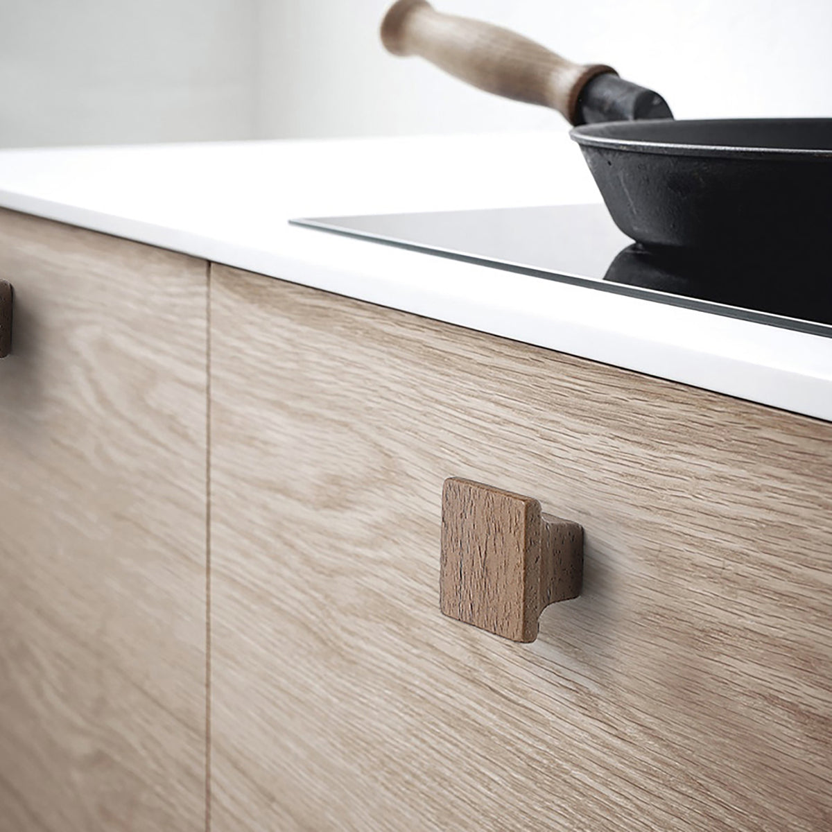 Flared square walnut cabinet knob, style #8 shown in a styled setting.