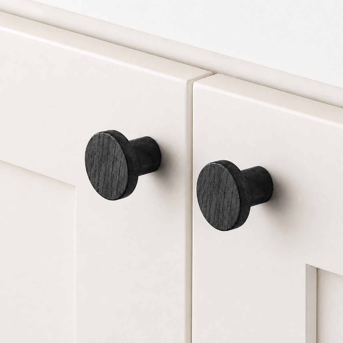 Cylindrical round black-finish oak cabinet knob, style #9 shown in a styled setting.