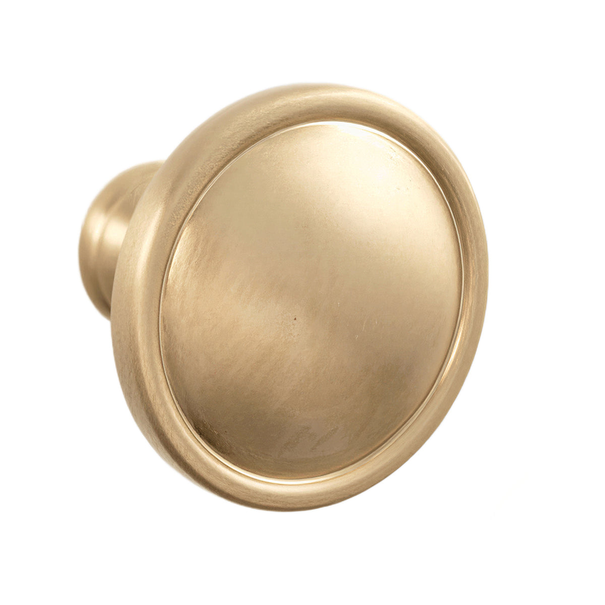 Brass-tone round cabinet knob with a shallow recessed face and raised rim.