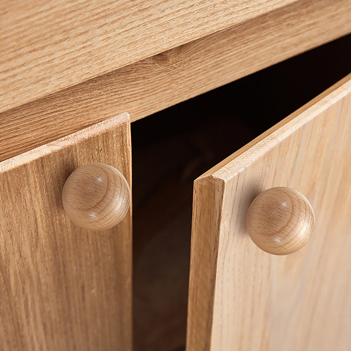 In-use view of beech wood ball cabinet knob, 35 mm option.