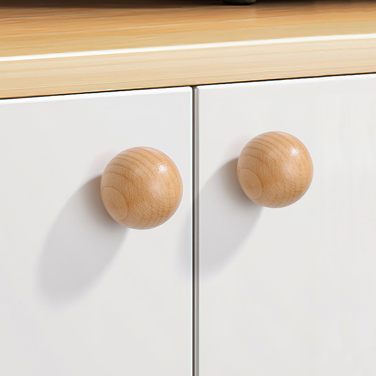 In-use view of beech wood ball cabinet knob, 40 mm option.