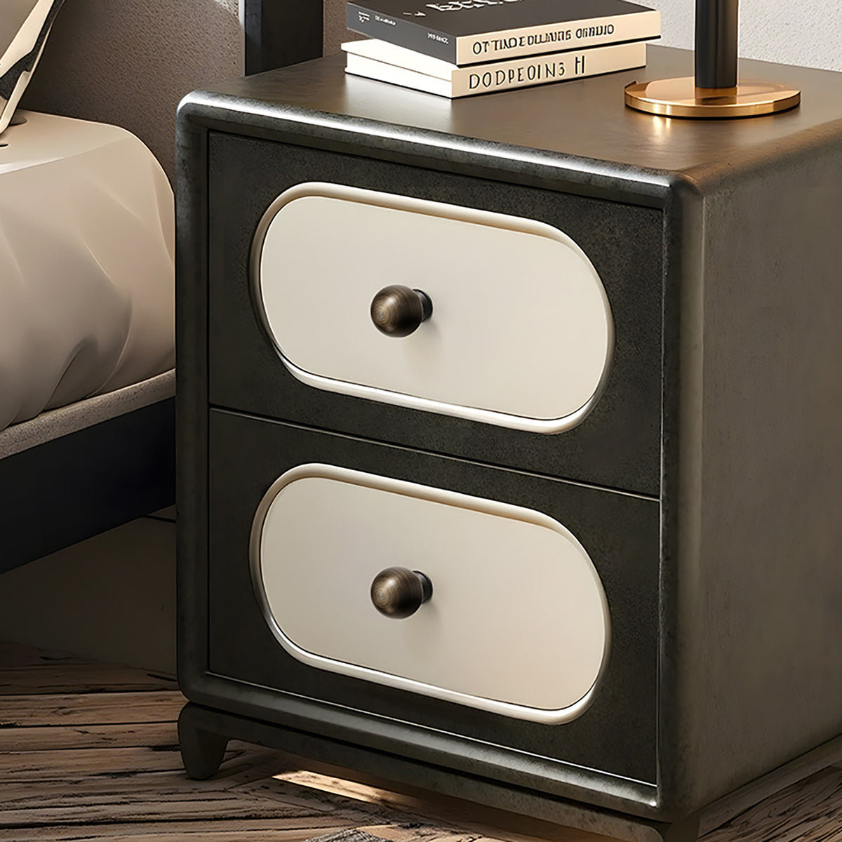 Round bronze-finish brass knobs on a two-drawer bedside cabinet.
