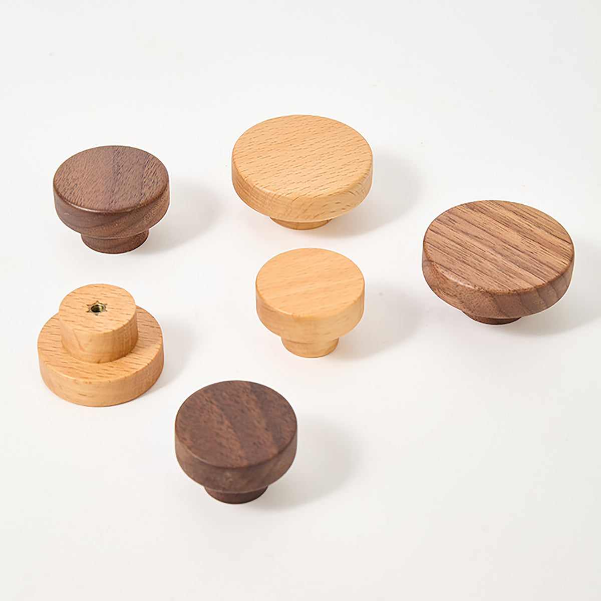Light oak and dark walnut wood round cabinet knobs, showing front and rear mounting views.