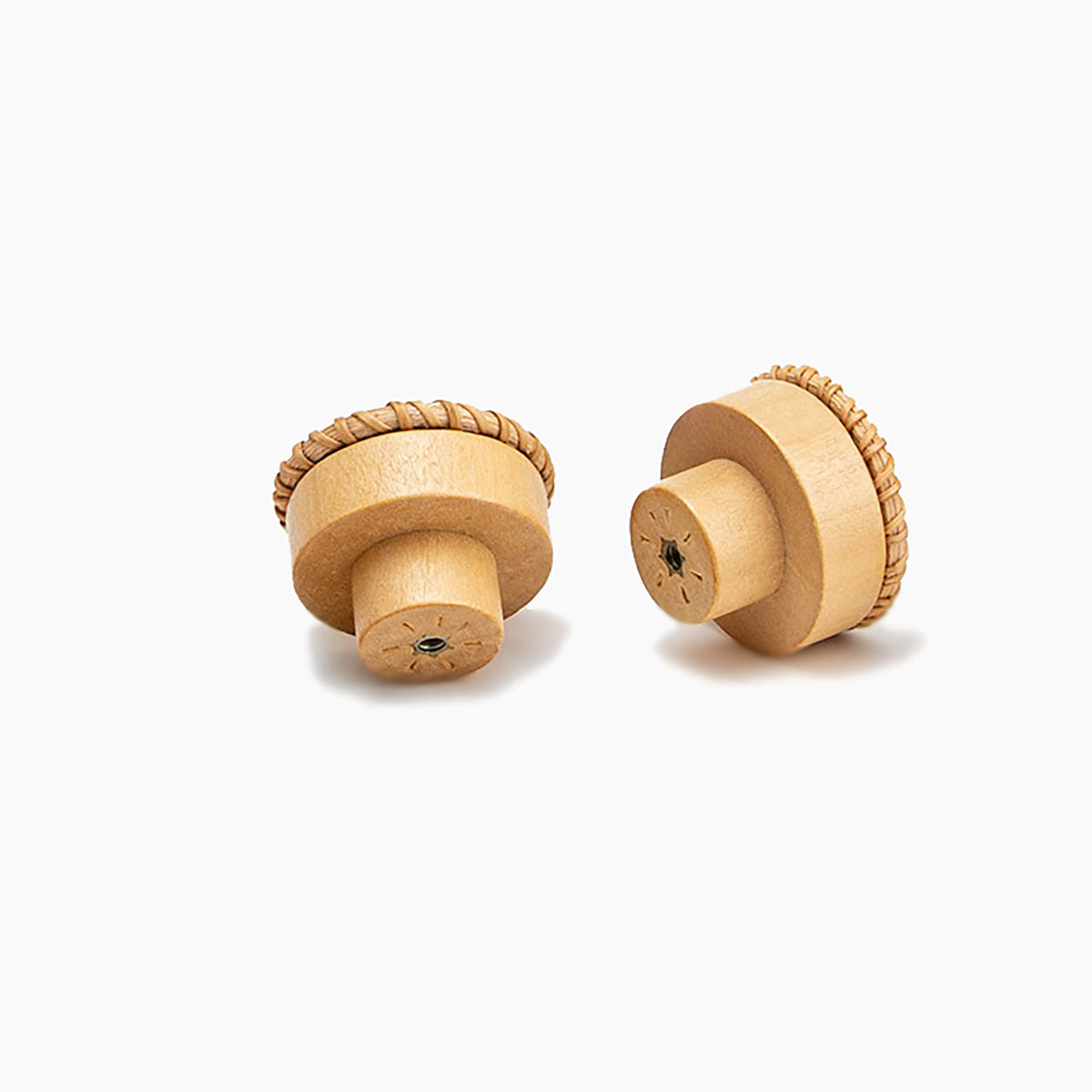 Two woven rattan-topped wood cabinet knobs viewed from the side and rear.