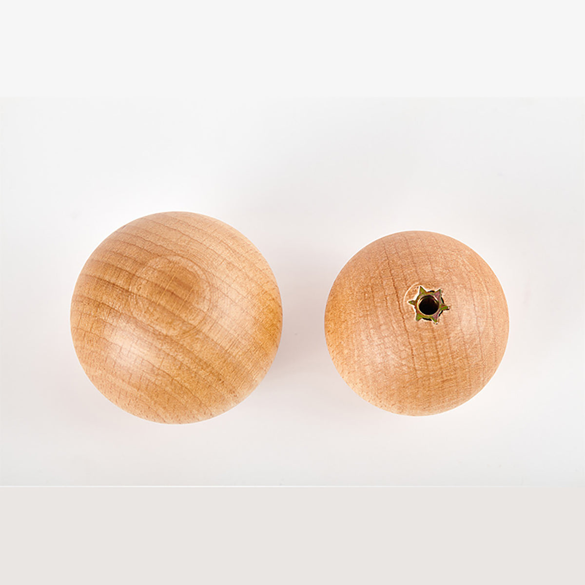 Beech wood ball cabinet knob, showing front and rear mounting hole.