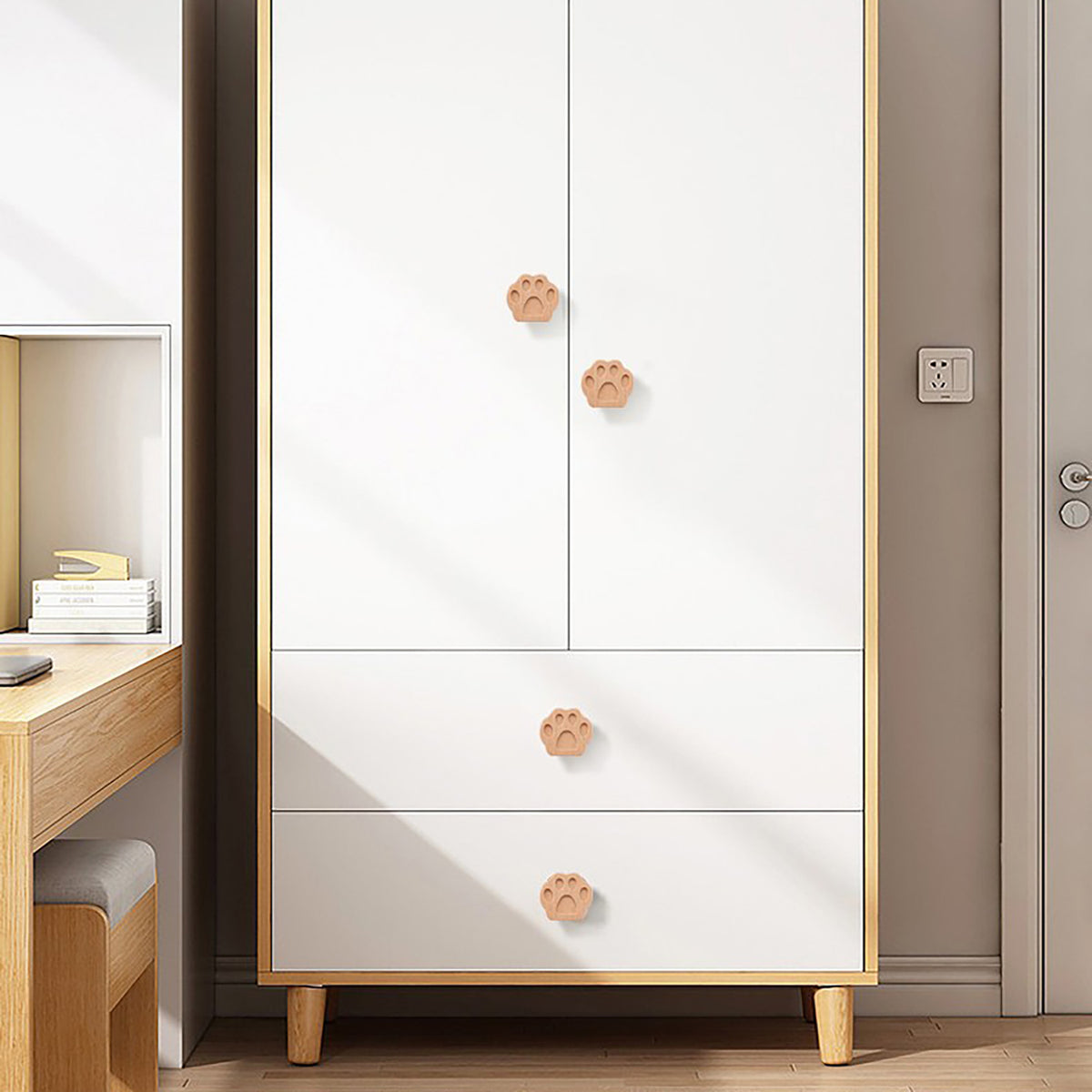 Paw-shaped wood knobs on a white chest.