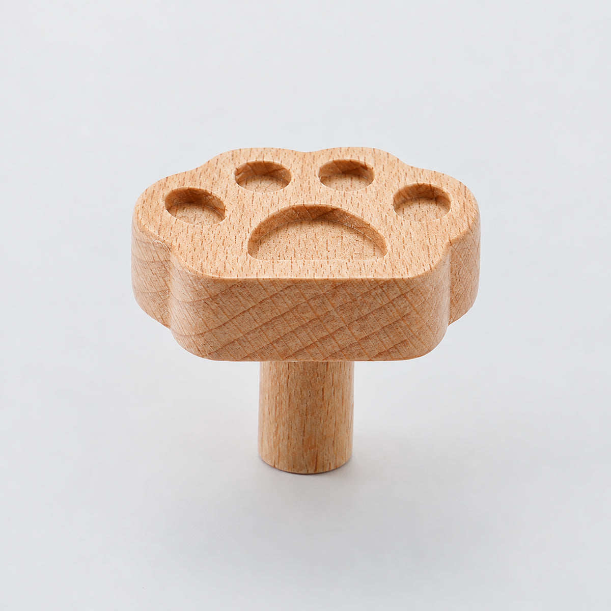 Multiple views of paw-shaped wood cabinet knob or wall hook, style #12.