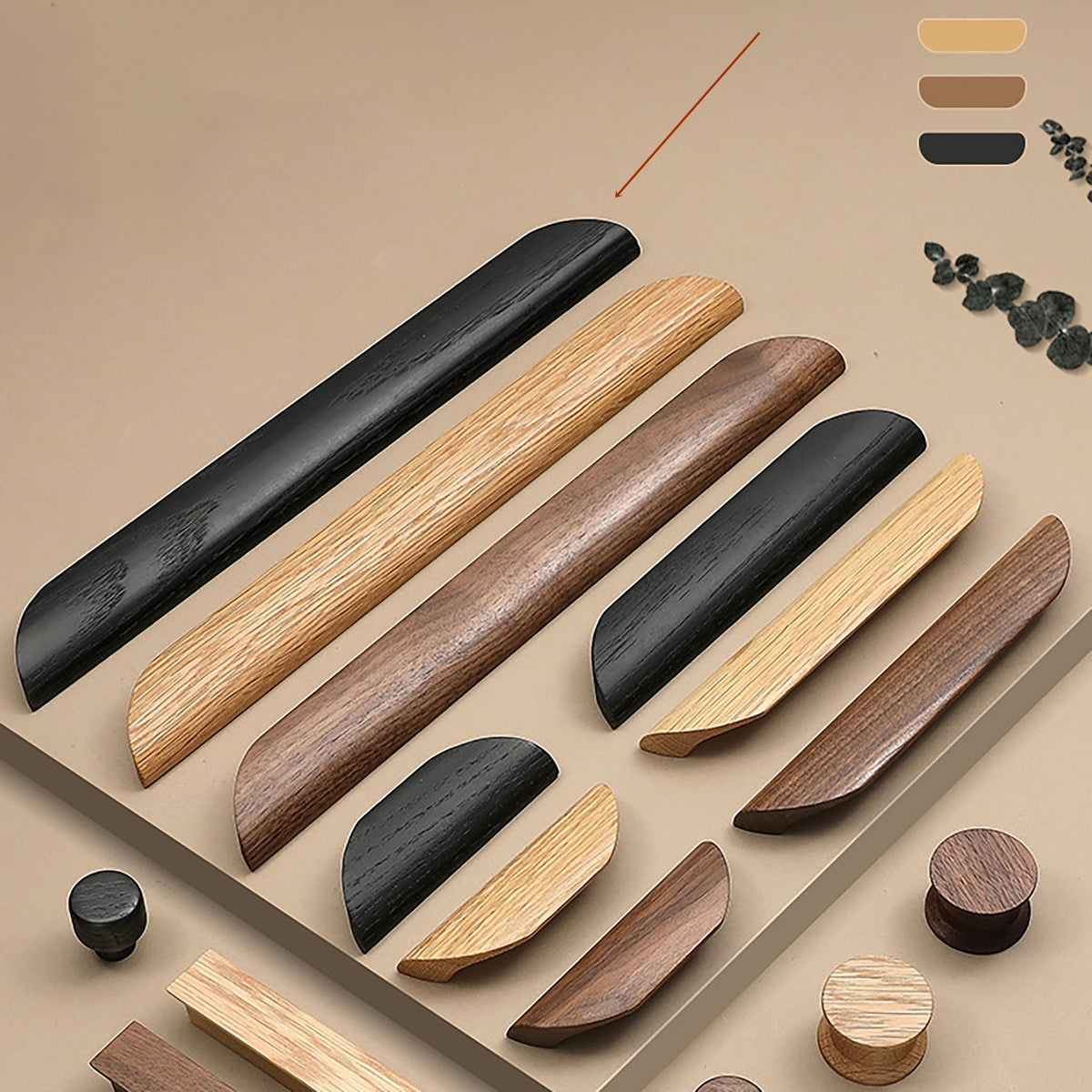 Assortment of black oak, beech and walnut cabinet pulls and knobs in several shapes and sizes.