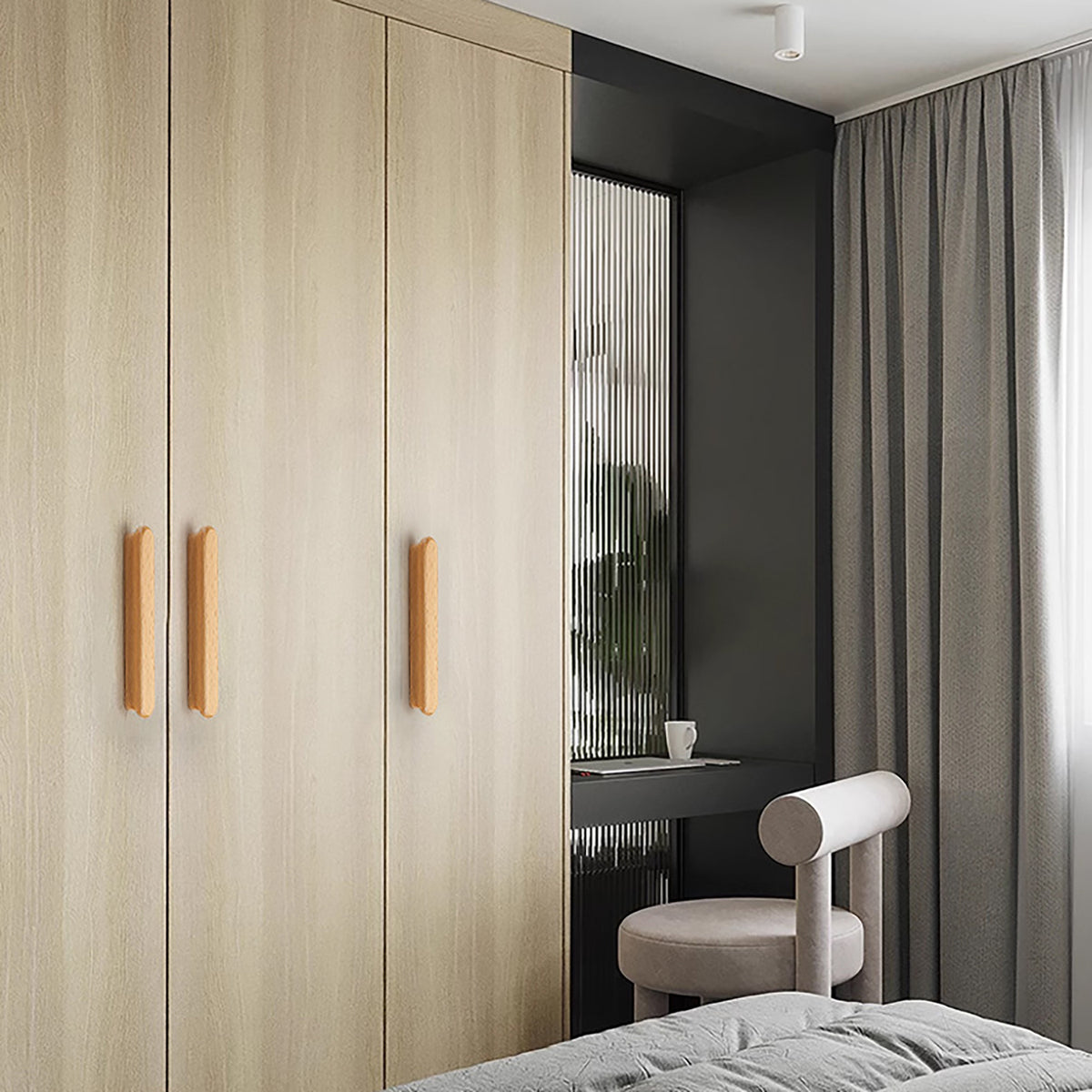 In-use view of slim rounded beech wood finger pull, 192 mm option.