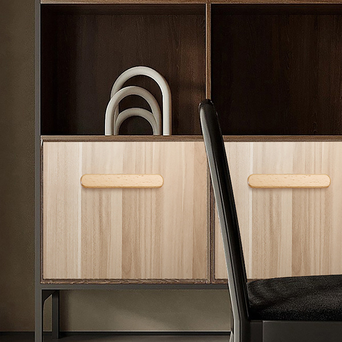 In-use view of slim rounded beech wood finger pull, 96 mm option.