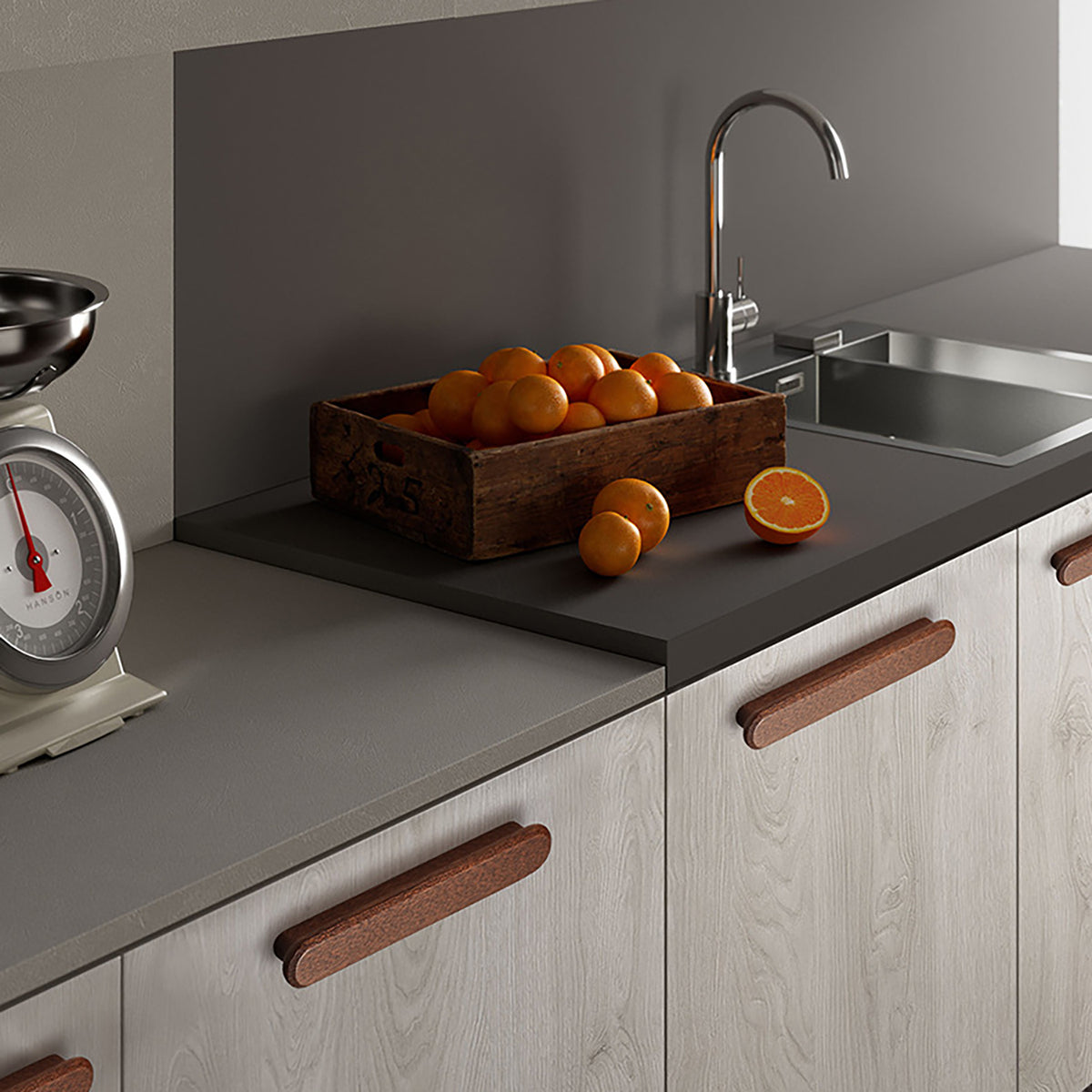 In-use view of slim rounded reddish wood finger pull, 128 mm option.
