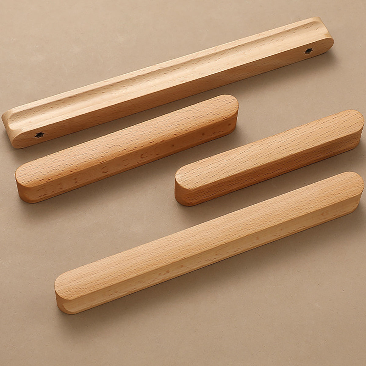 Beech wood cabinet finger pulls in several lengths, showing front profiles and rear mounting holes.