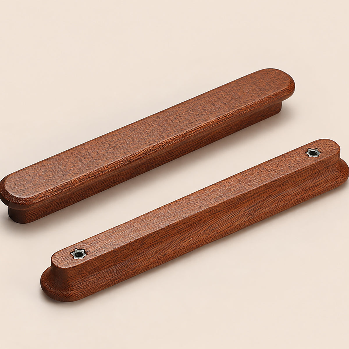 Two reddish wood finger pulls, showing front and back mounting holes.