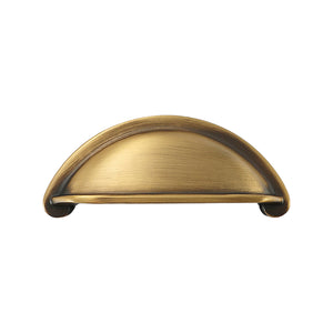Open-Back Cup Pull in Aged Brass, front view.