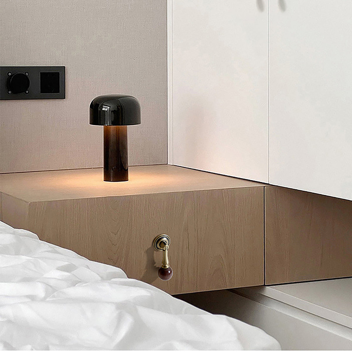 In-use view of bronze-finish drop pull with dark wood ball end, style #4 Bronze.