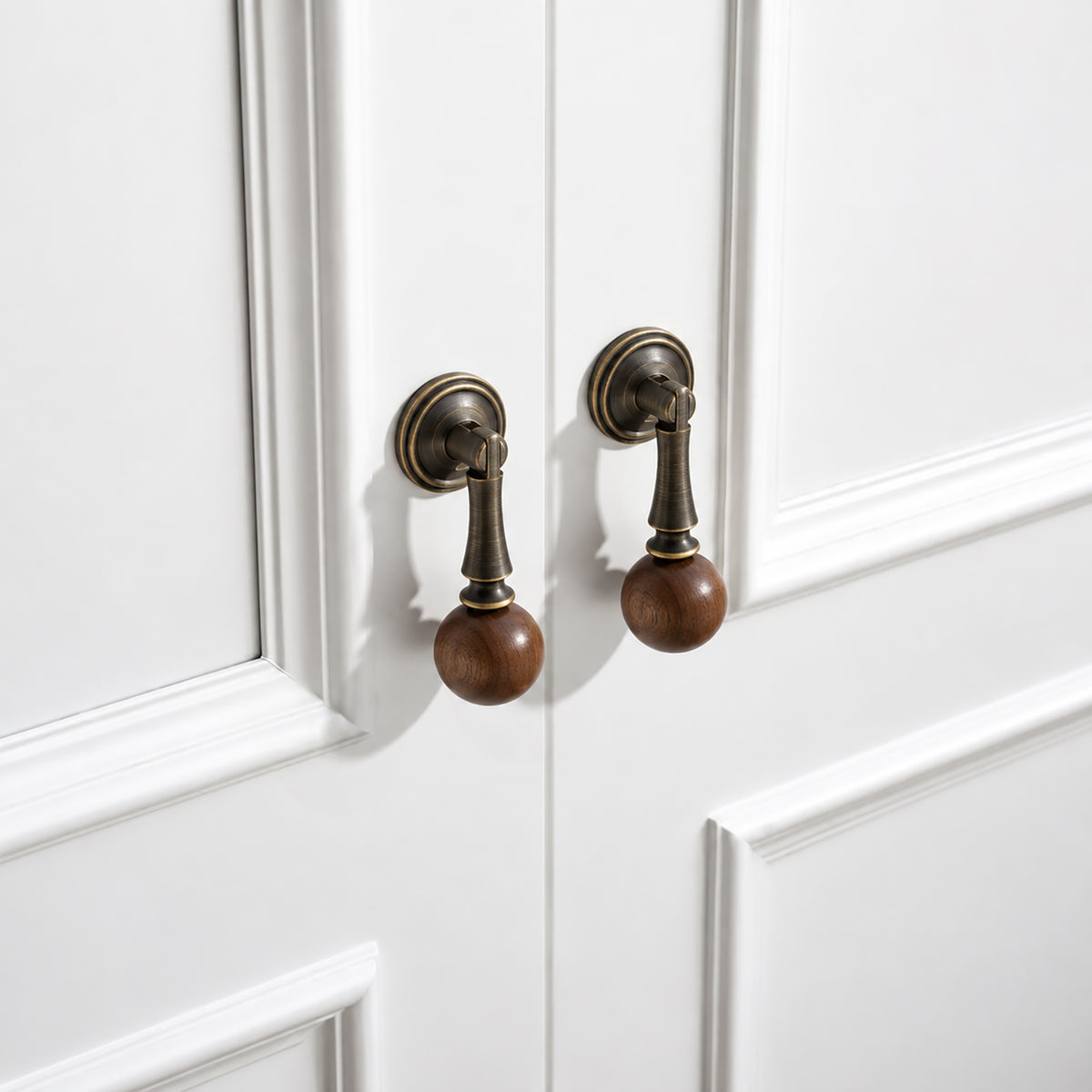 In-use view of coffee-finish drop pull with dark wood ball end, style #4 Coffee.