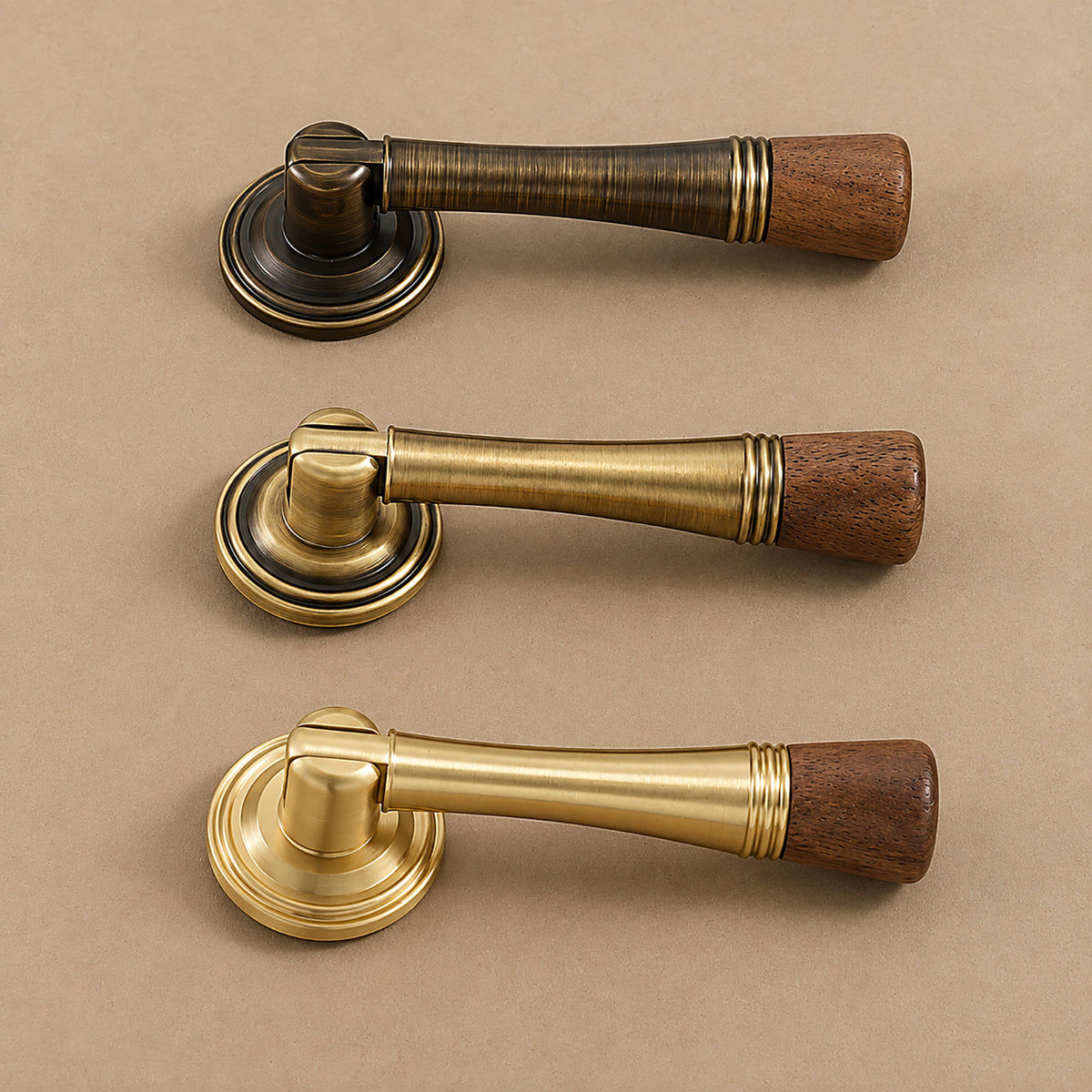 Three wood-ended brass and bronze drop pulls with round mounting plates, shown from the side.
