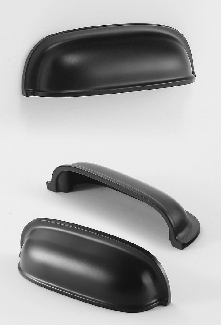 Front, underside and angled views of the solid brass rounded dome cup pull in Matte Black.