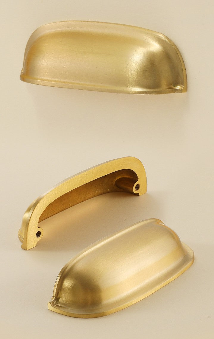 Front, rear and angled views of the solid brass rounded dome cup pull in Satin Brass.