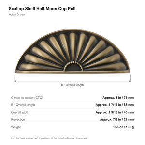 Dimensions of the scallop shell half-moon cup pull in Aged Brass: 76 mm center-to-center, 88 mm long, 40 mm wide and 22 mm projection.