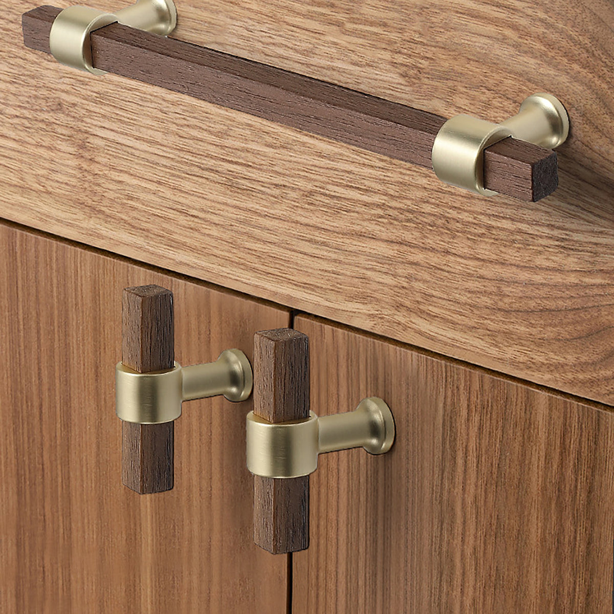 In-use view of faceted walnut wood T-bar cabinet pull with a round brass center mount, style #3.