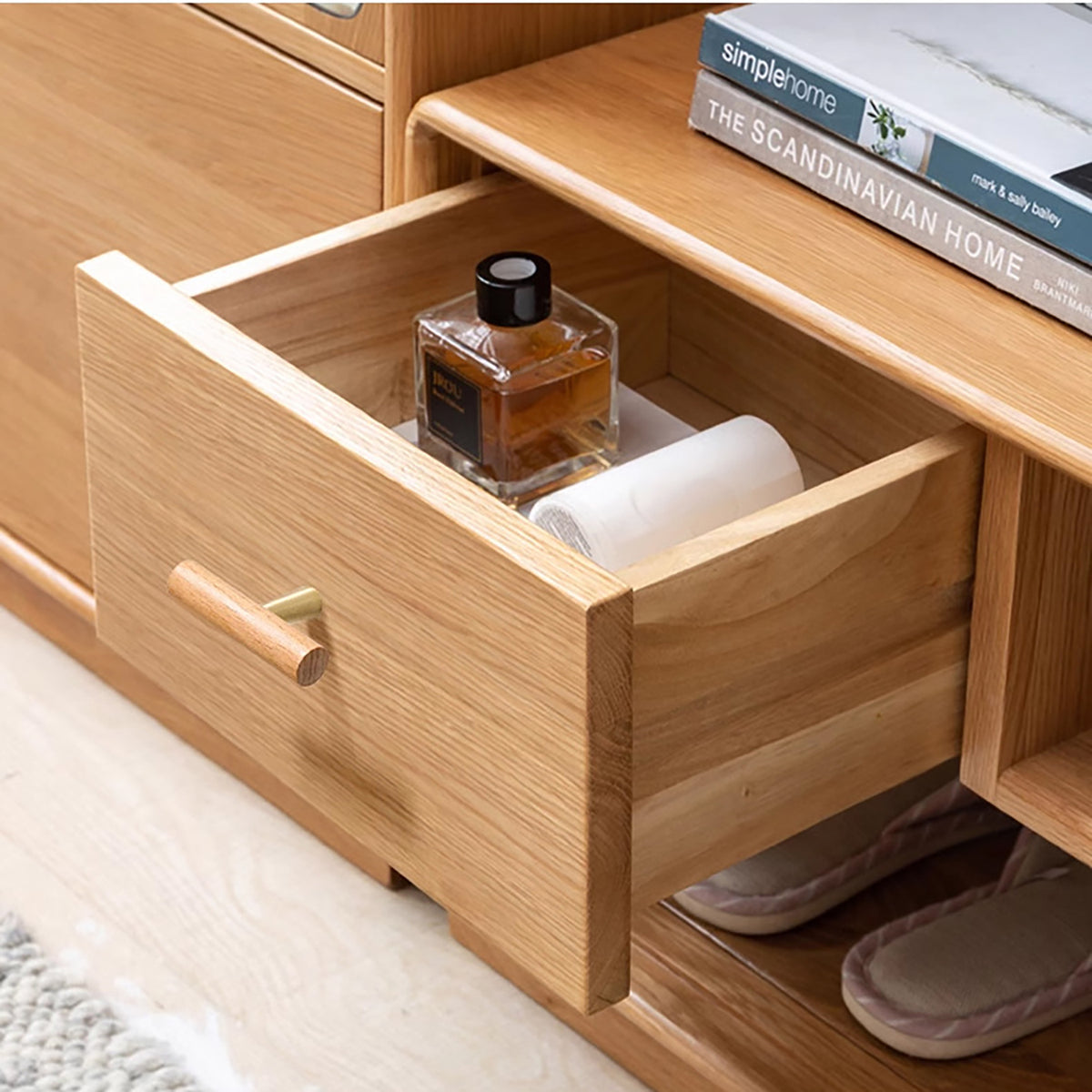 In-use view of slim beech wood T-bar cabinet pull with brass stem, style #8.