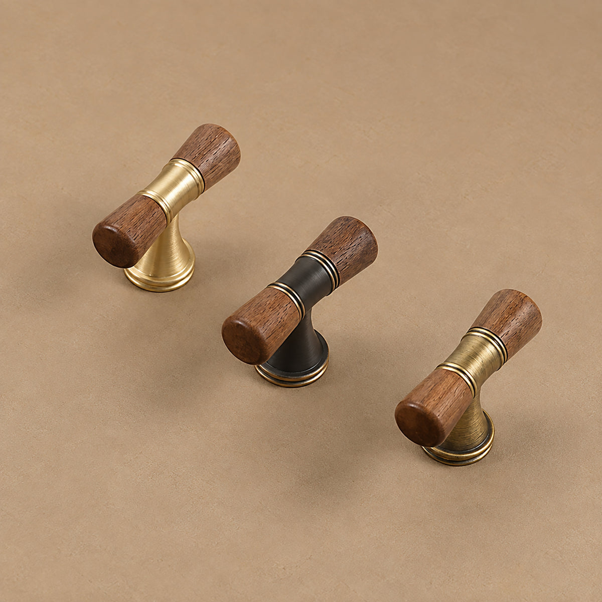 Three dark wood-ended T-bar pulls in brass, coffee and bronze finishes.